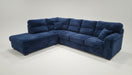Blue sectional sofa on a white background