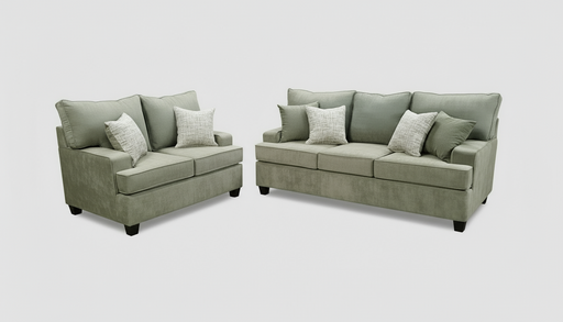 Sofa and loveseat set with toss pillows  in a furniture store setting