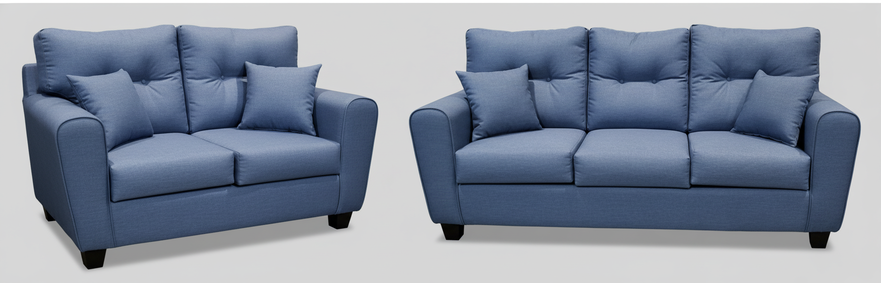 A  blue 2 person loveseat style sofa and  3 person sofa in a studio setting