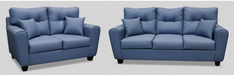 A  blue 2 person loveseat style sofa and  3 person sofa in a studio setting