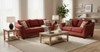 Red sofa set with patterned toss pillows on a gray background