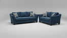 Blue sectional sofa with patterned toss pillows in a furniture store setting
